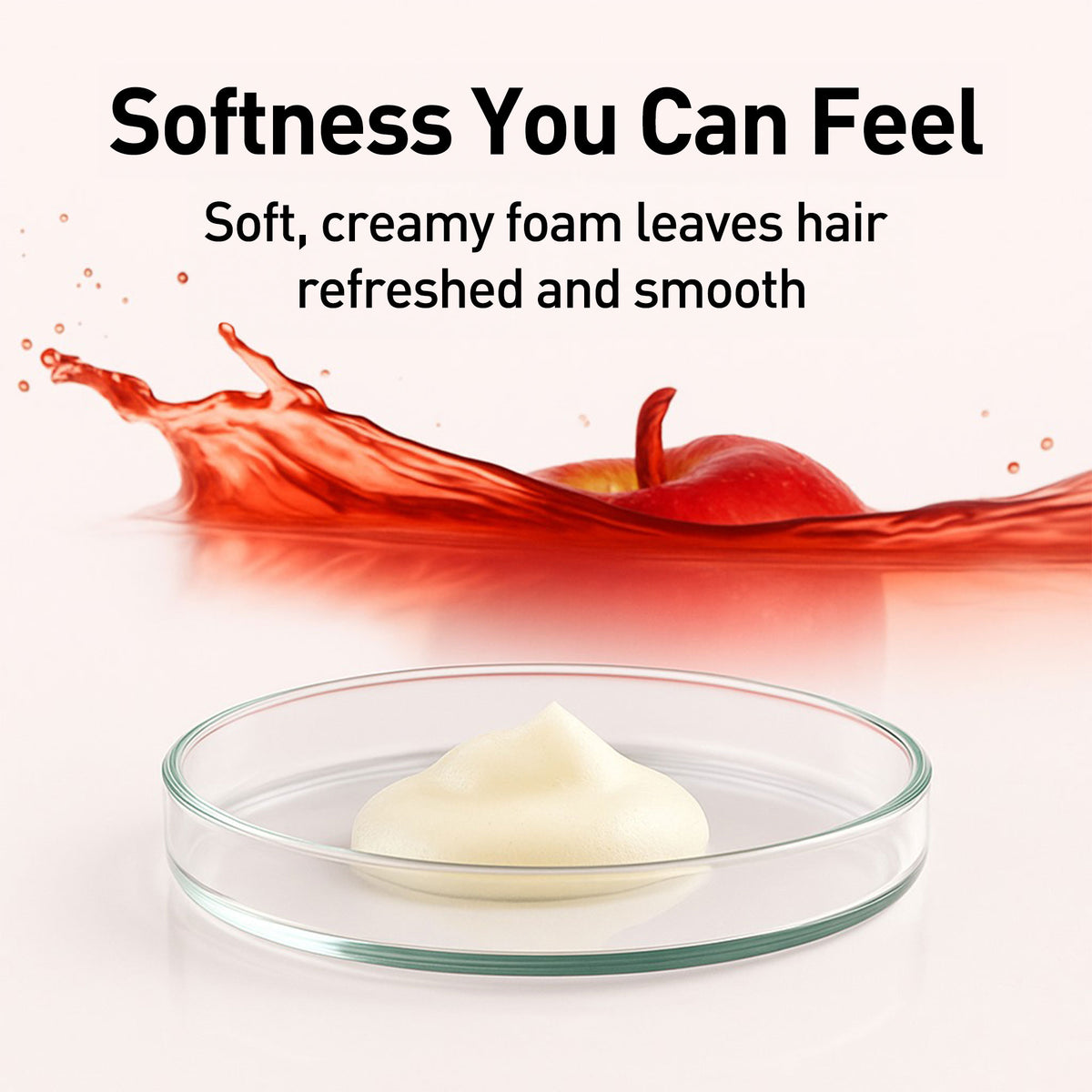 Creamy white substance in a glass dish with red liquid and apple in the background, labeled 'Softness You Can Feel'.