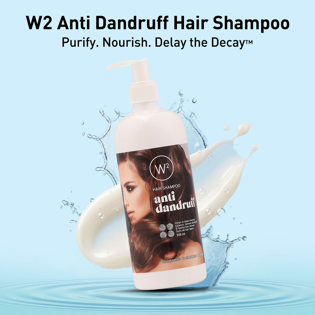 W2 Anti Dandruff Hair Shampoo bottle with water splash on a light blue background