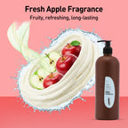Brown bottle of apple conditioner with apples and whipped cream on a pink background