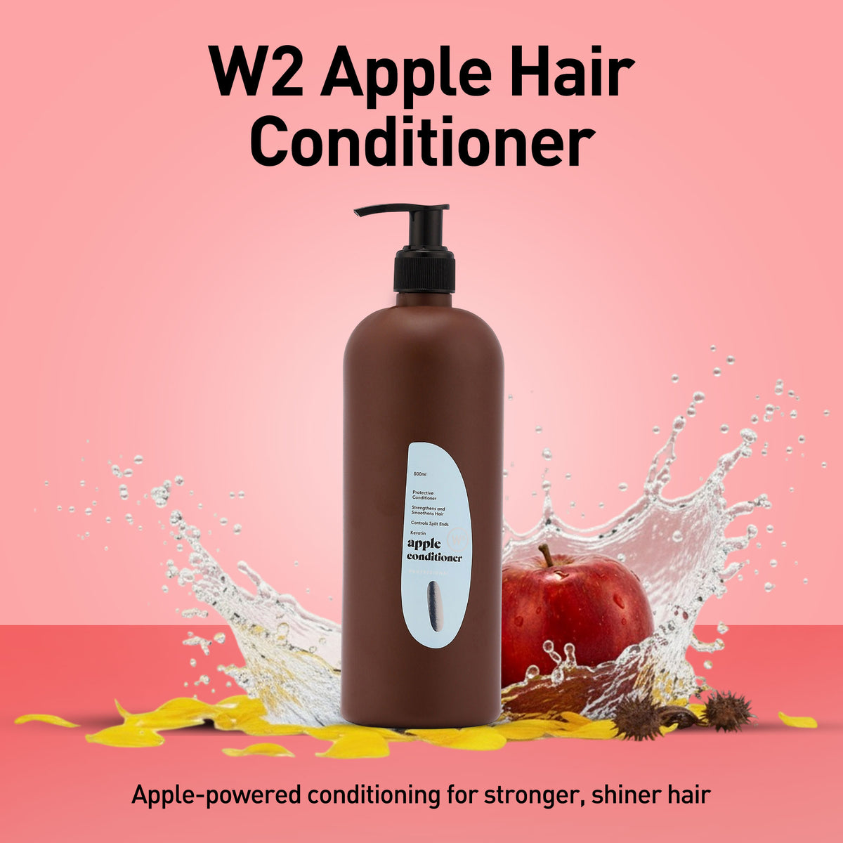 Brown hair conditioner bottle with apple and water splash on a pink background