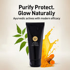 Black tube of W2 Neem & Turmeric Face Wash with turmeric and neem leaves on a beige background