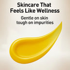 Yellow skincare product smear with text 'Skincare That Feels Like Wellness' on a beige background