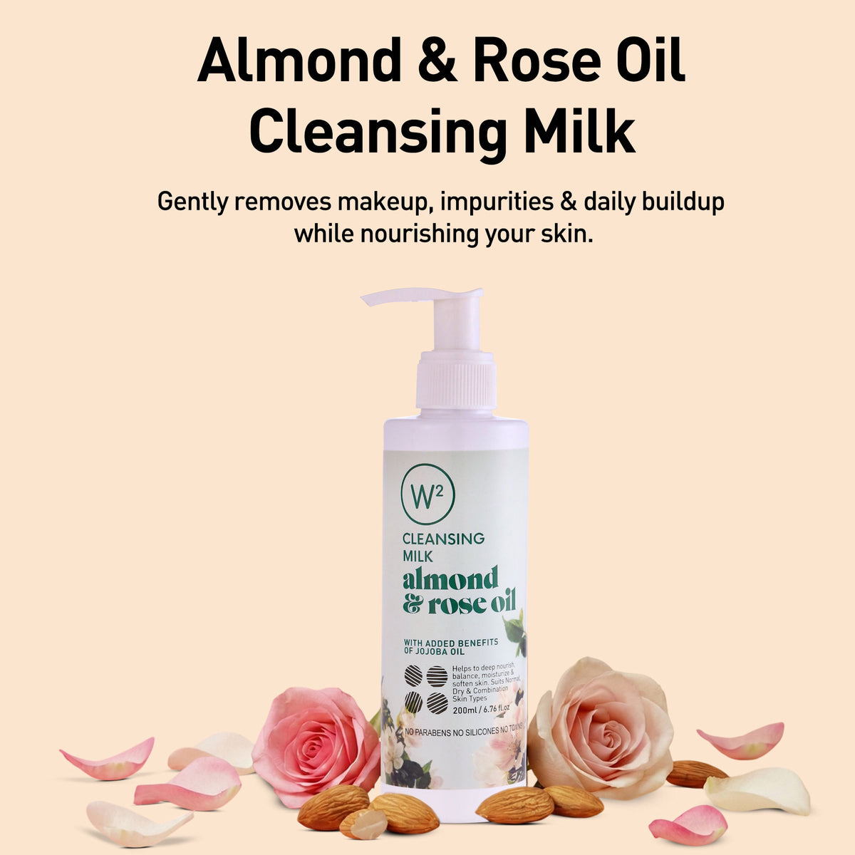 Almond & Rose Oil Cleansing Milk bottle with roses and almonds on a beige background
