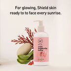 Lotion bottle with pink label and natural elements on a light background