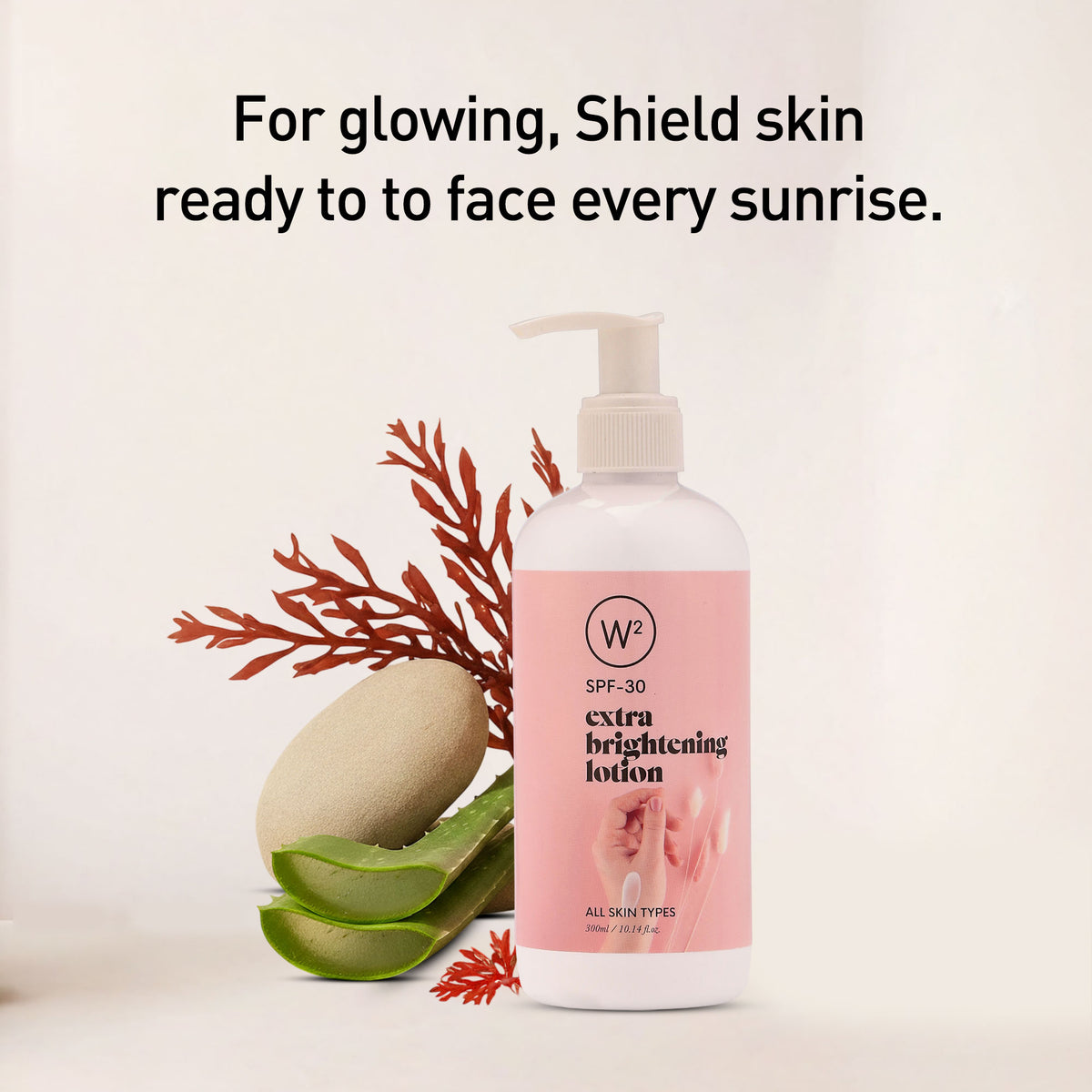 Lotion bottle with pink label and natural elements on a light background