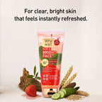 Strawberry face wash tube with natural ingredients on a light background