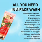 Strawberry face wash packaging with text on a blue background