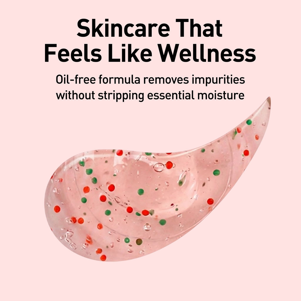 Pink skincare product with colorful specks on a pink background, featuring text about oil-free formula.