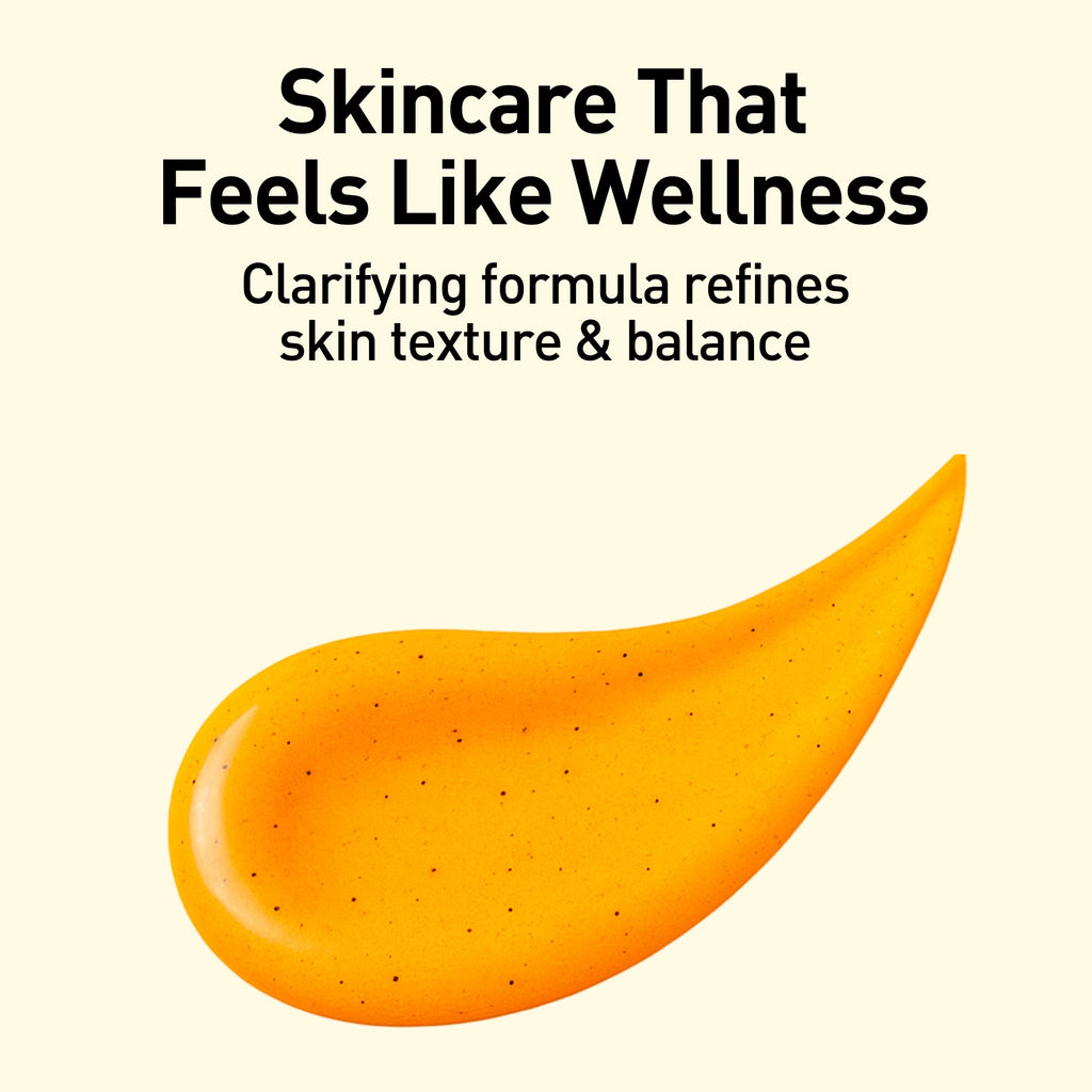 Orange skincare product with text on a beige background