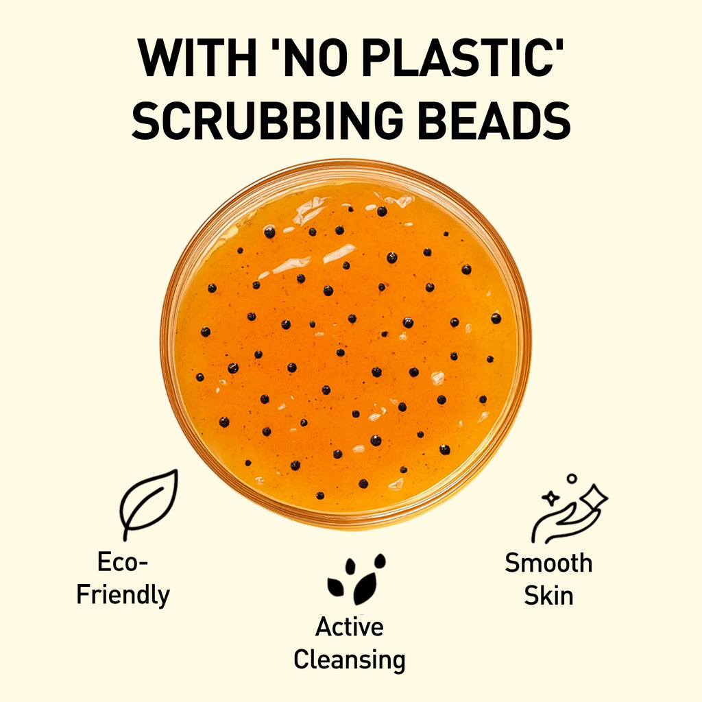 Orange scrub with black beads in a jar, labeled 'No Plastic Scrubbing Beads', on a beige background.