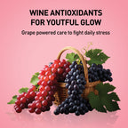 Wine antioxidants with grapes in a basket on a pink background