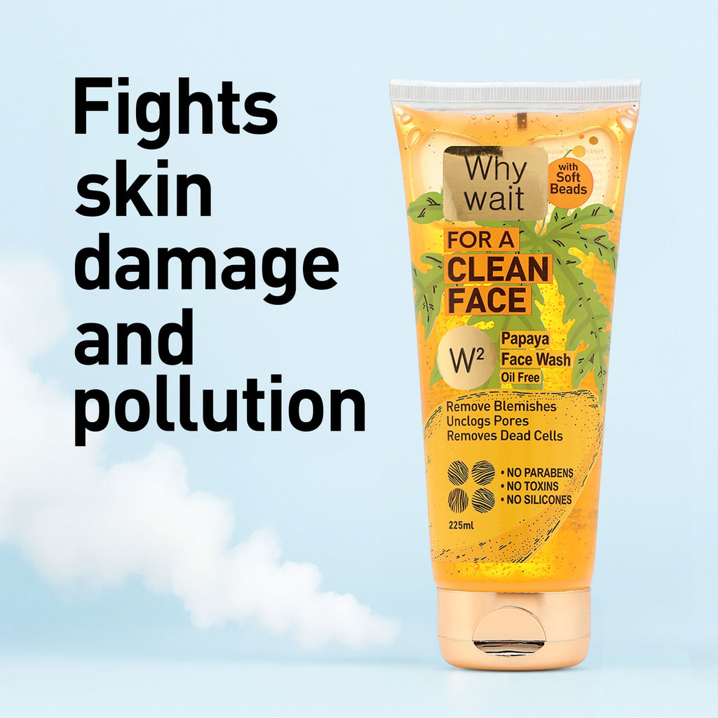 Papaya face wash tube with text on a light blue background