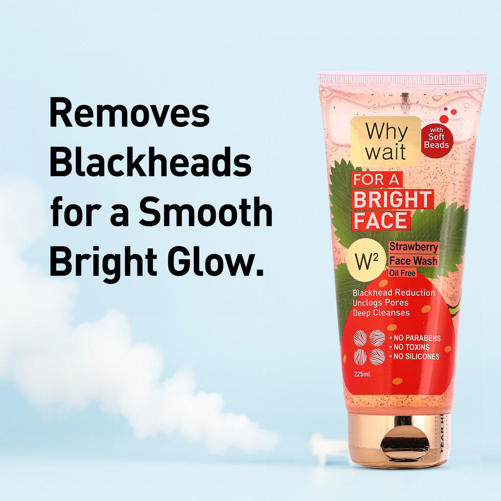 Strawberry face wash tube with text on a light blue background