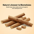 Wooden sticks with text about Mulethi for blemishes on a beige background