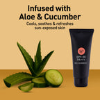 Black tube of sunscreen with aloe vera and cucumber on a beige background