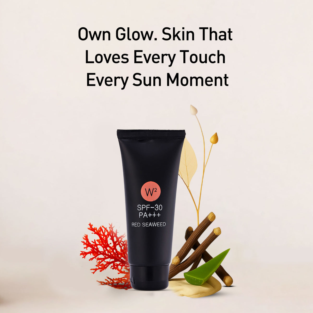 A black skincare product with red seaweed and leaves on a beige background.