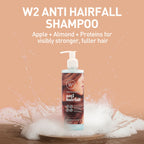 W2 Anti Hairfall Shampoo bottle with shampoo being poured, on a beige background