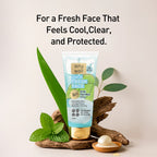 Tube of 'Why Wait' face wash with green leaves and wooden elements on a light background